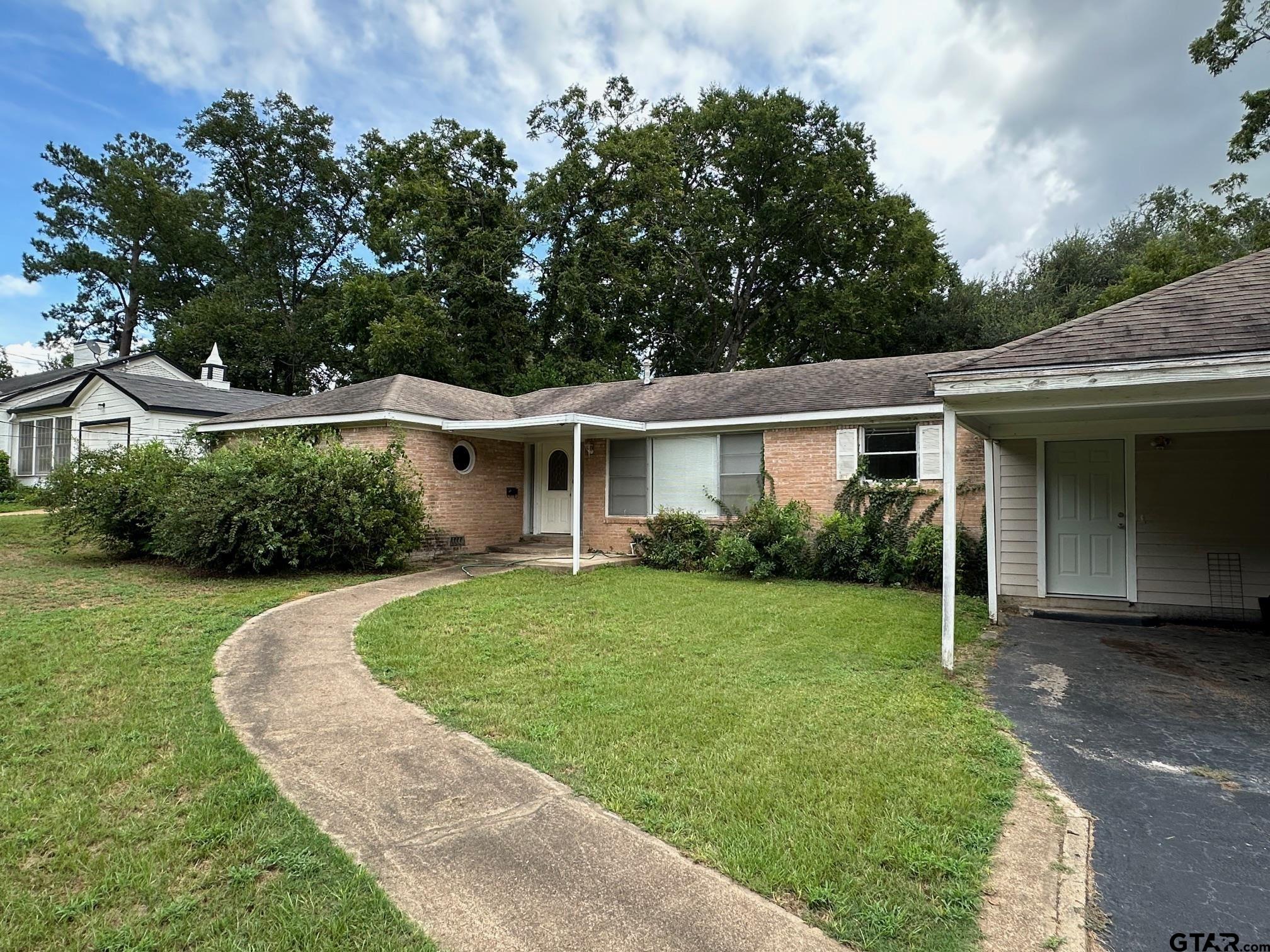 front view of a house with a yard