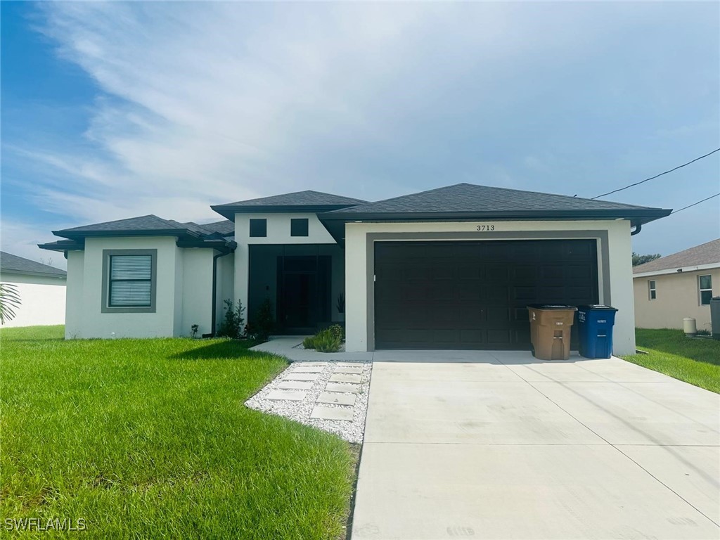 front view of a house with a yard