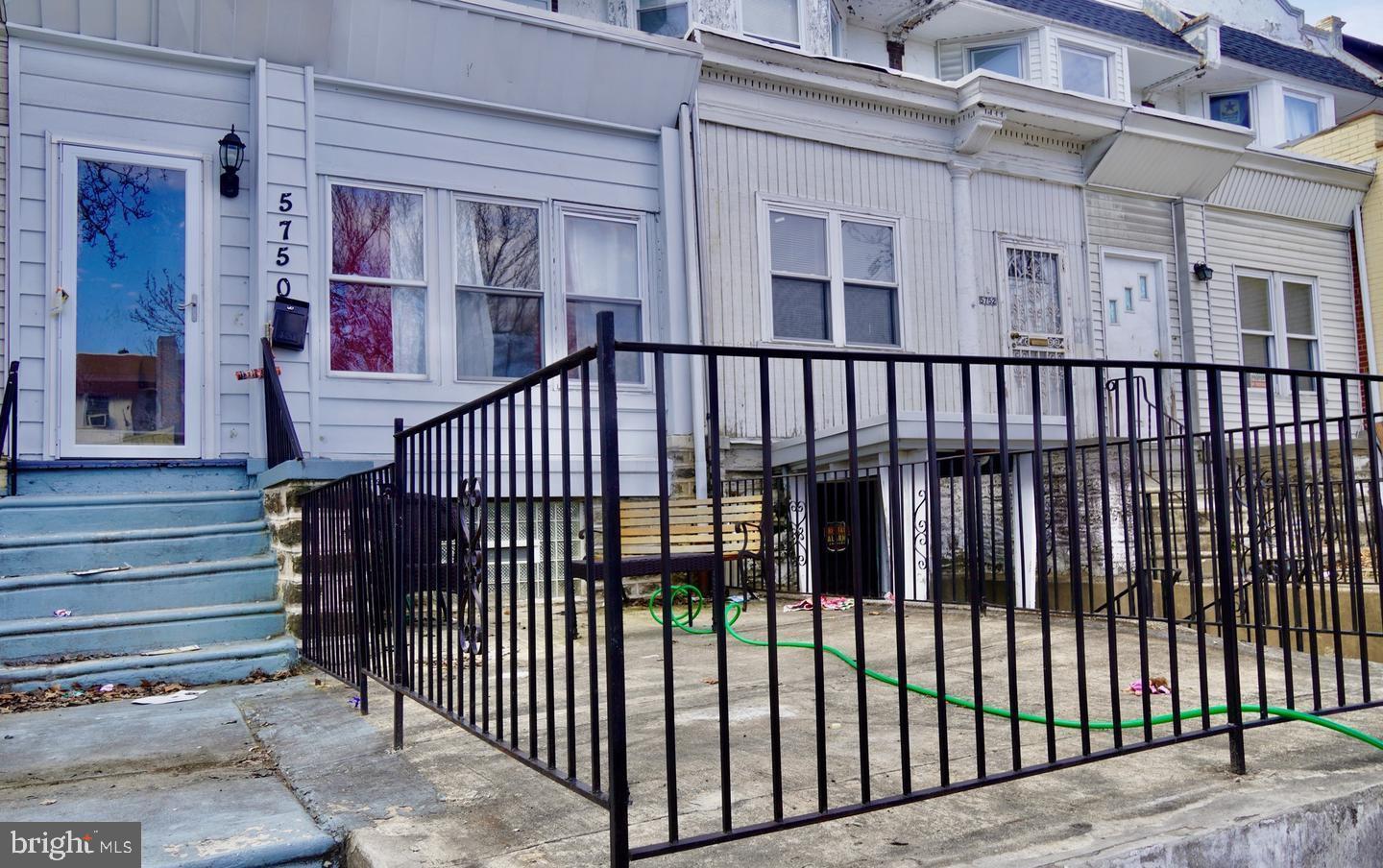 a view of a balcony with wooden fence