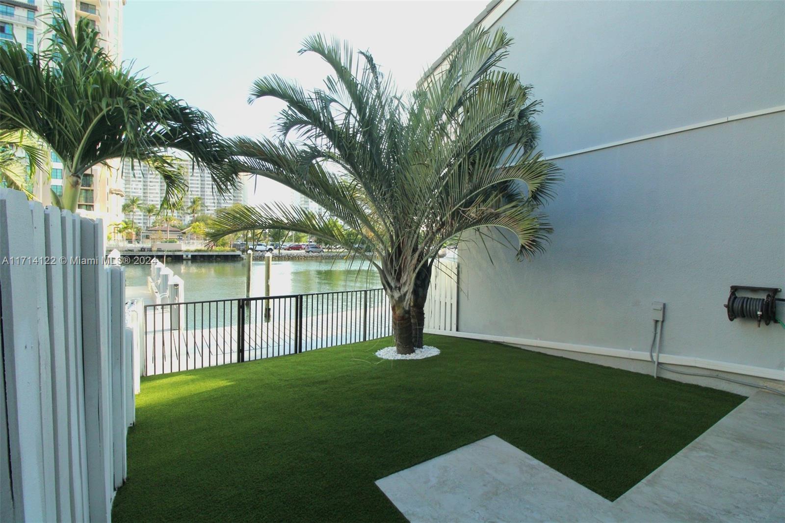 a view of a garden with a tree in it