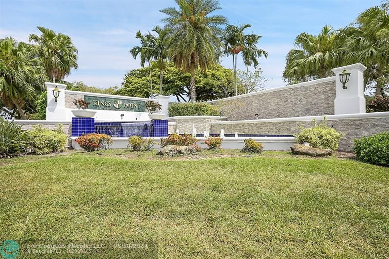 a view of backyard with outdoor seating and green space