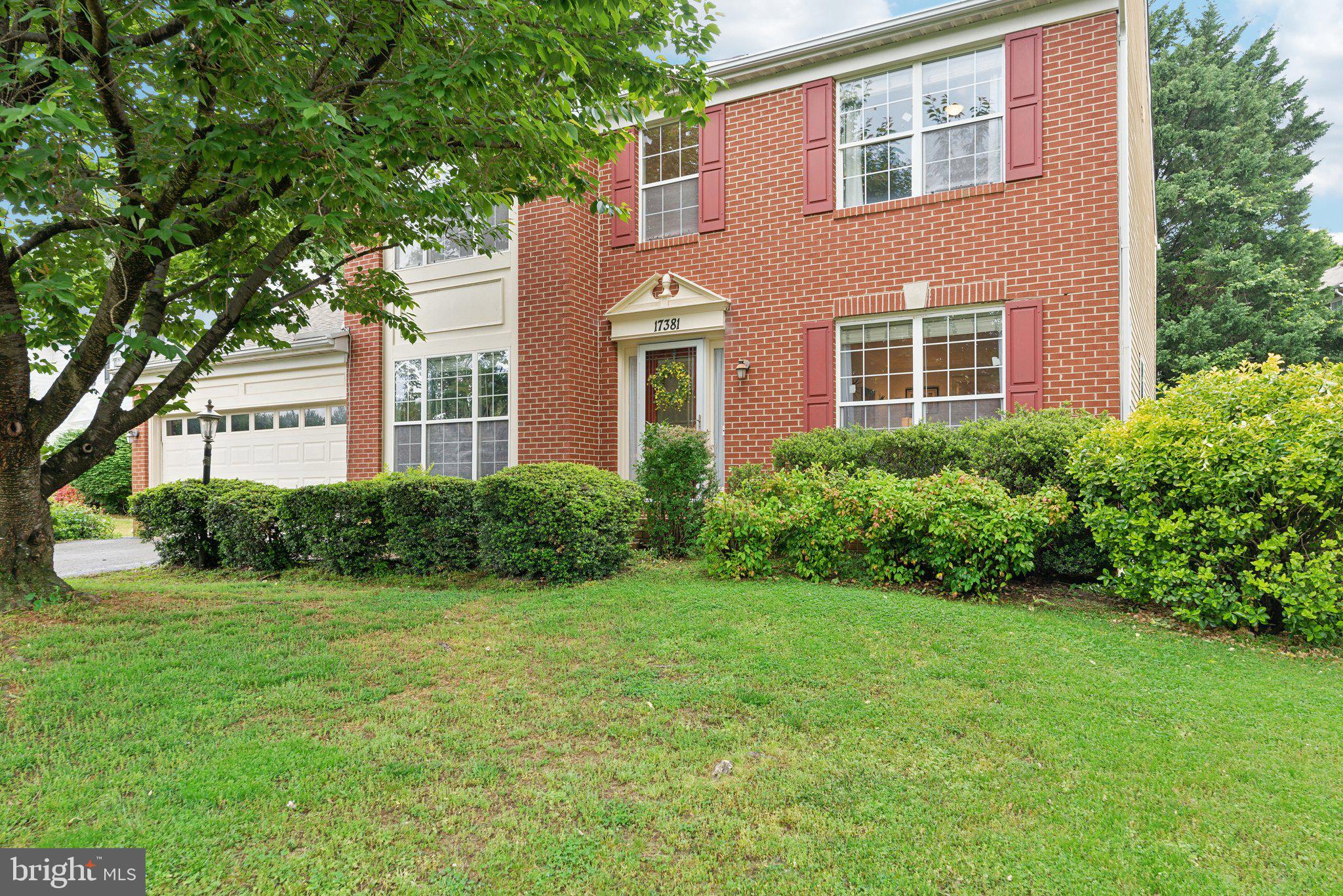 a view of a brick building next to a yard