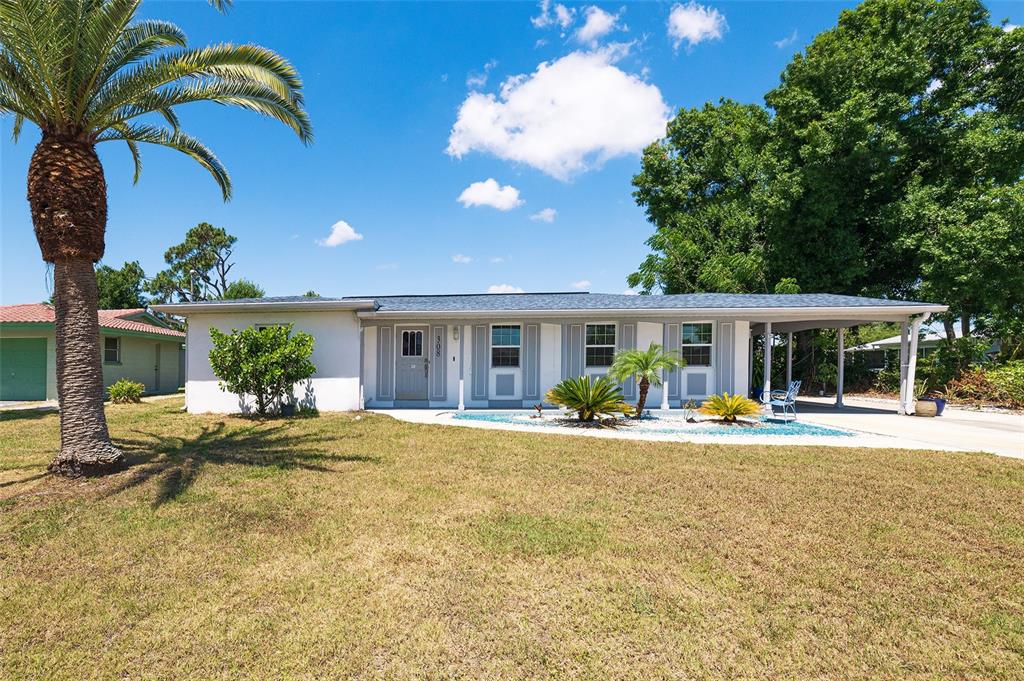 a house view with swimming pool and garden space