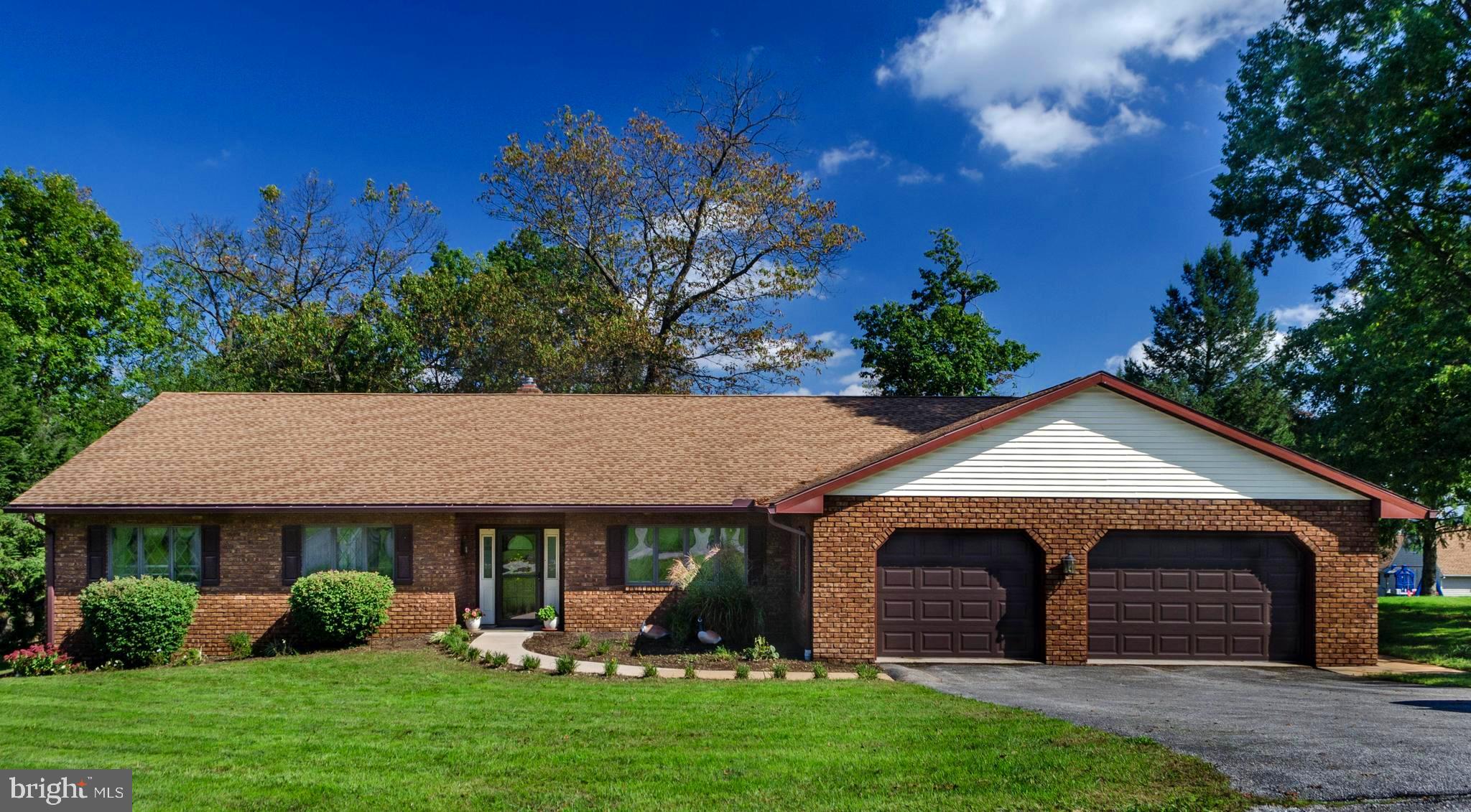 a view of a house with garden and yard