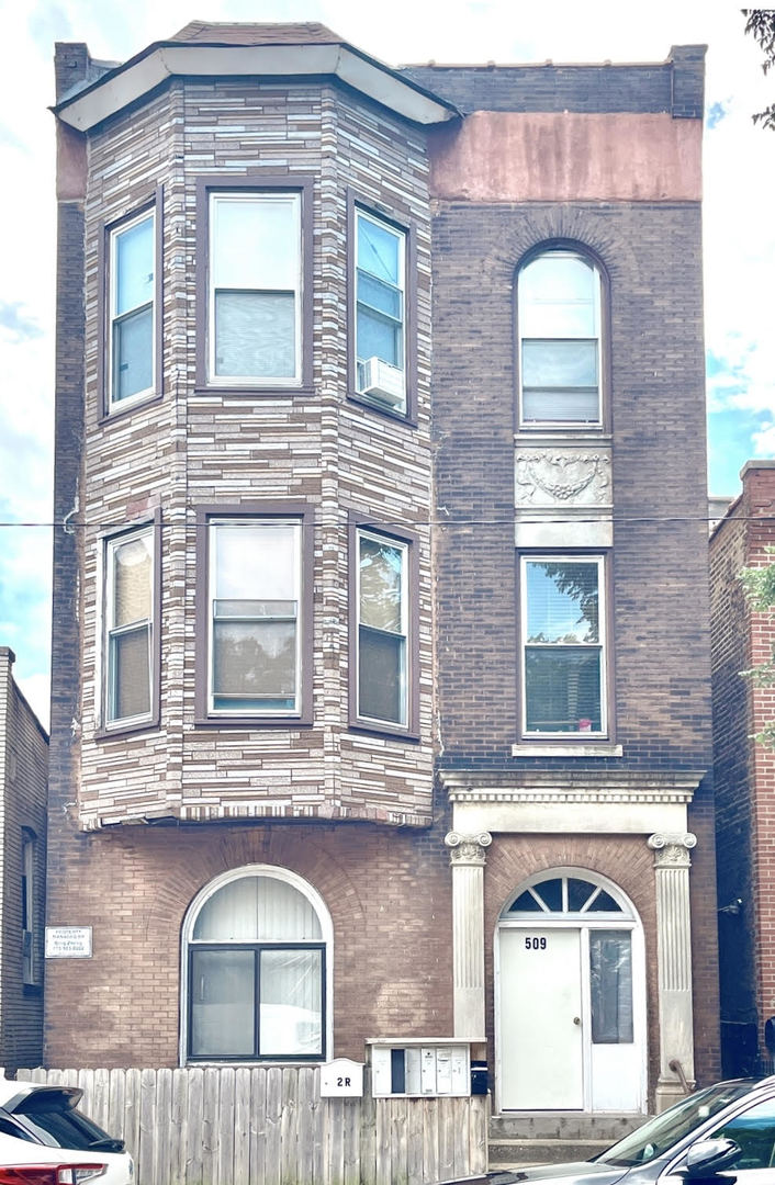 front view of a brick house with a door