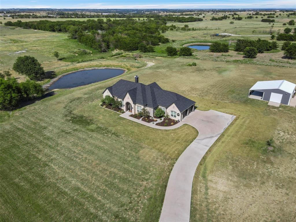 a view of a lake with a yard