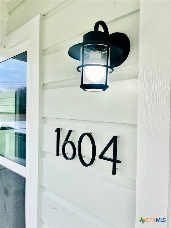 a close view of light fixtures and a window