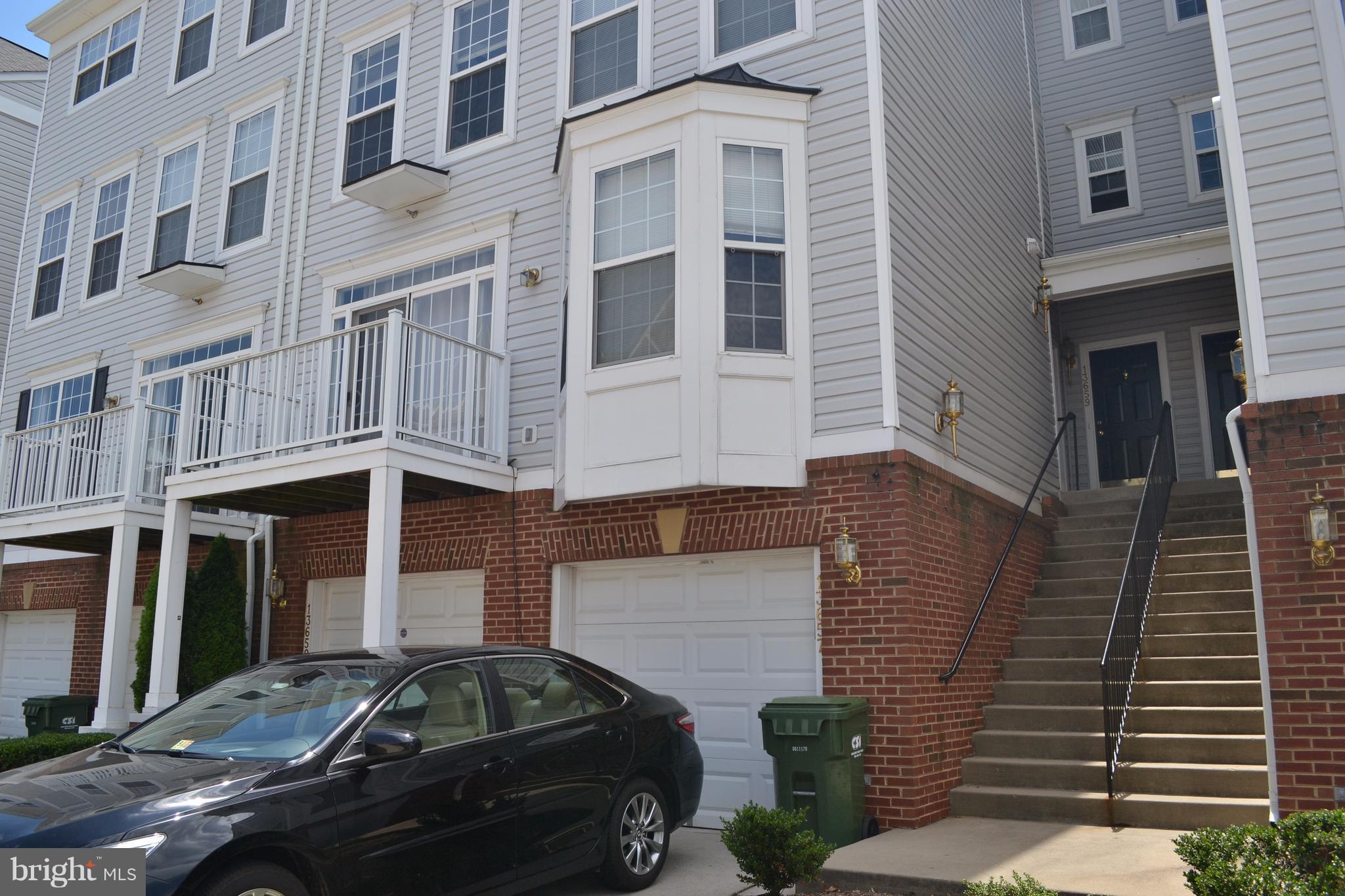 a front view of a house with parking space