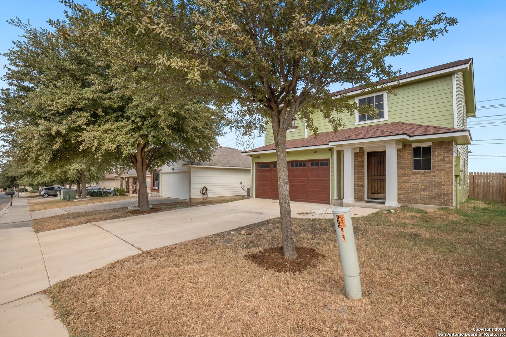 front view of a house with a small yard