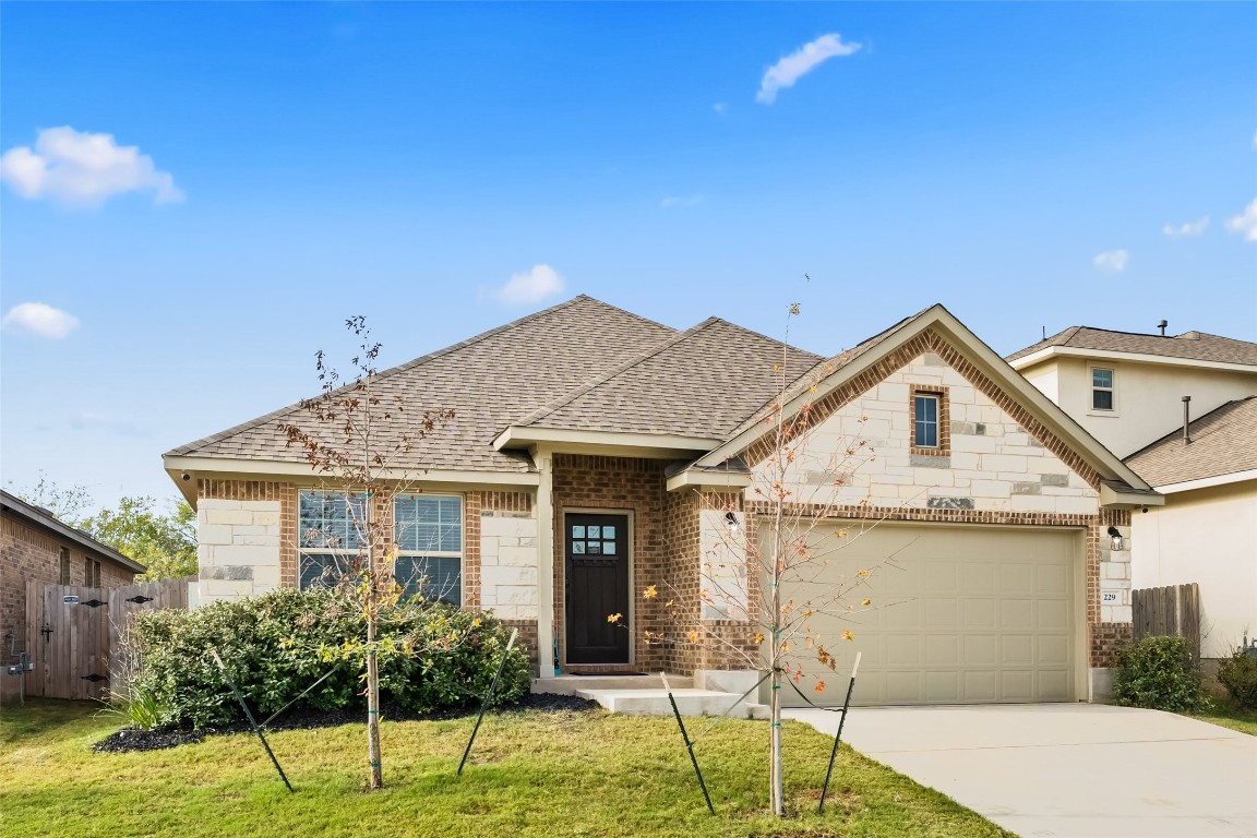 a front view of a house with a yard