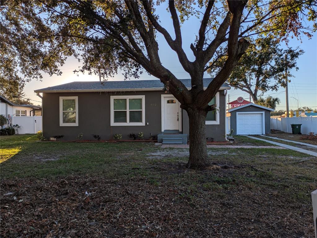 a house with trees in front of it