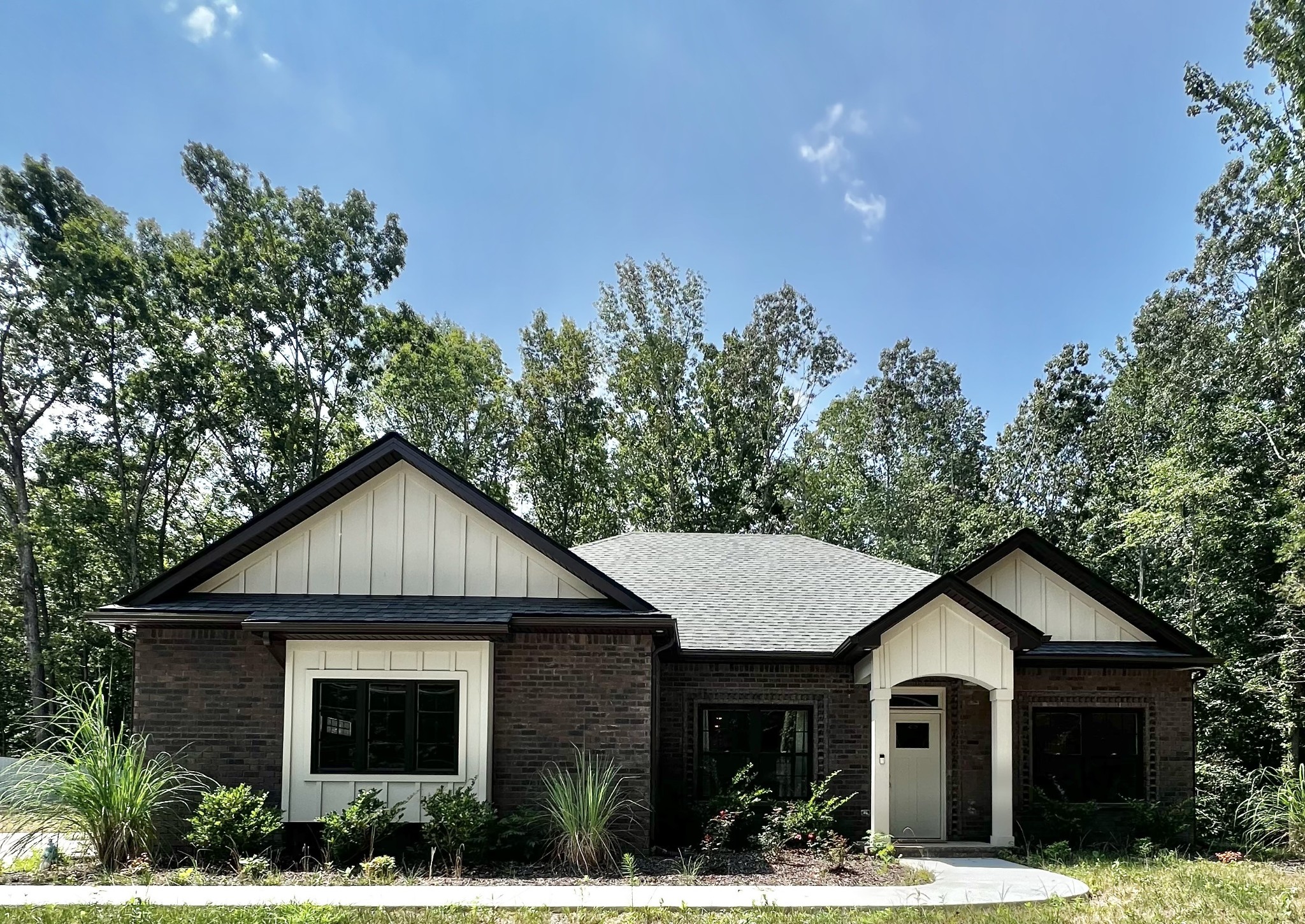 a front view of a house with a yard