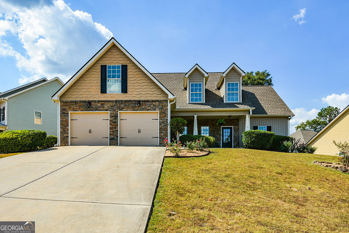 a front view of a house with a yard