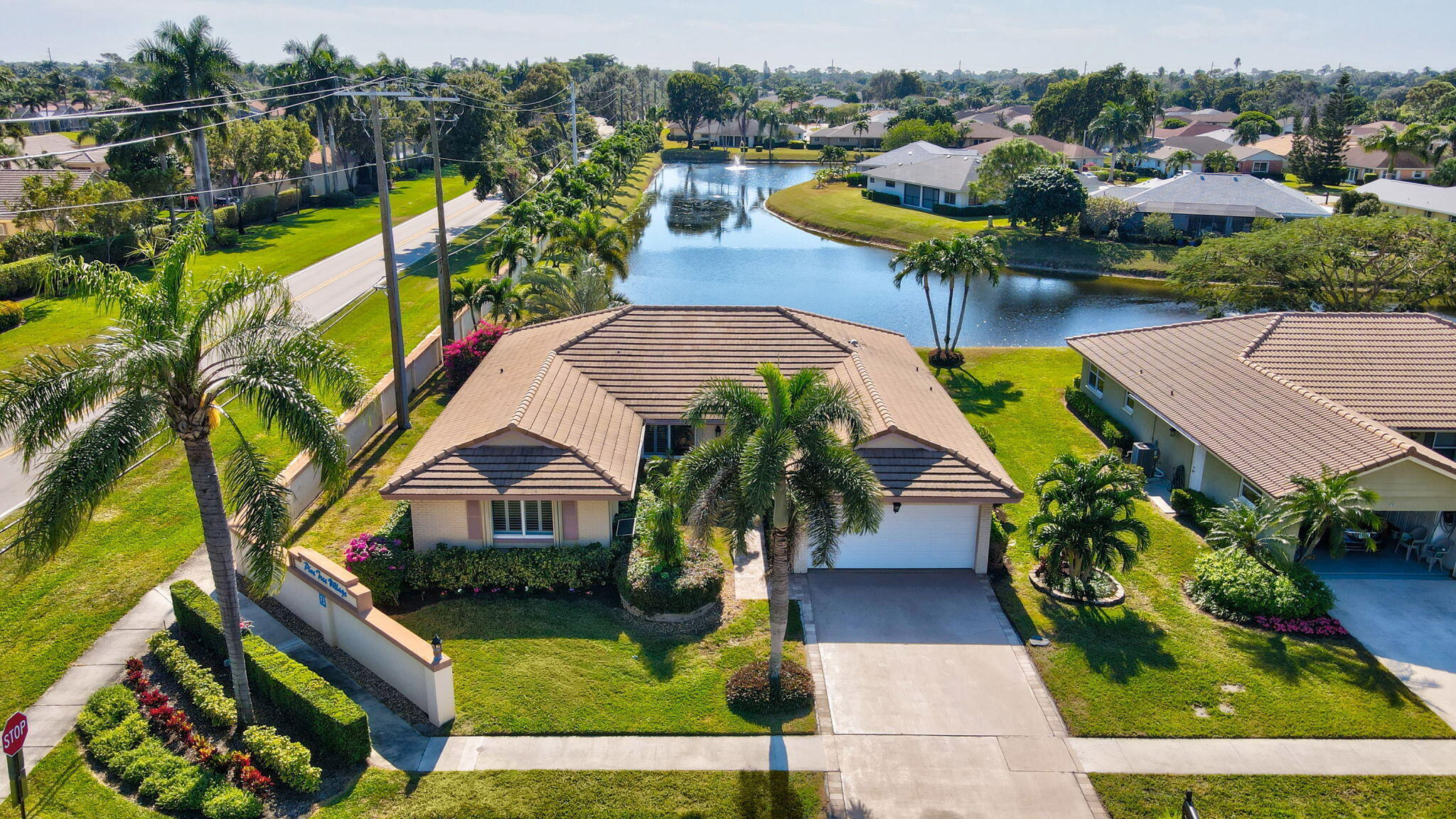 an aerial view of residential houses with outdoor space and swimming pool