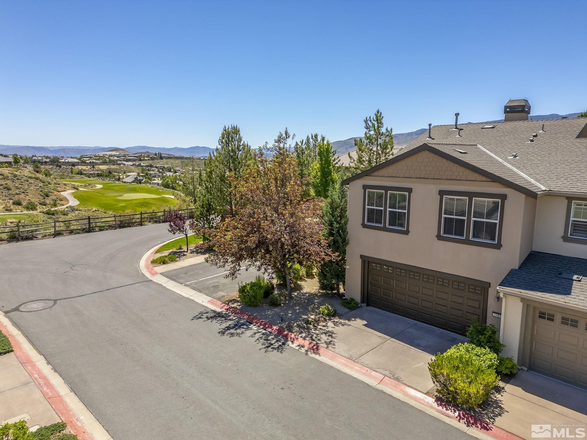 a aerial view of a house with a yard