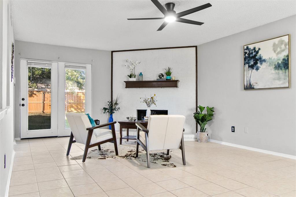 a view of a livingroom with furniture and a window