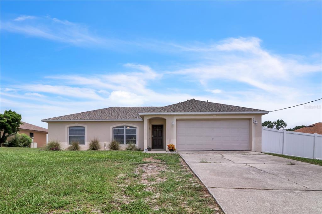 front view of a house with a yard