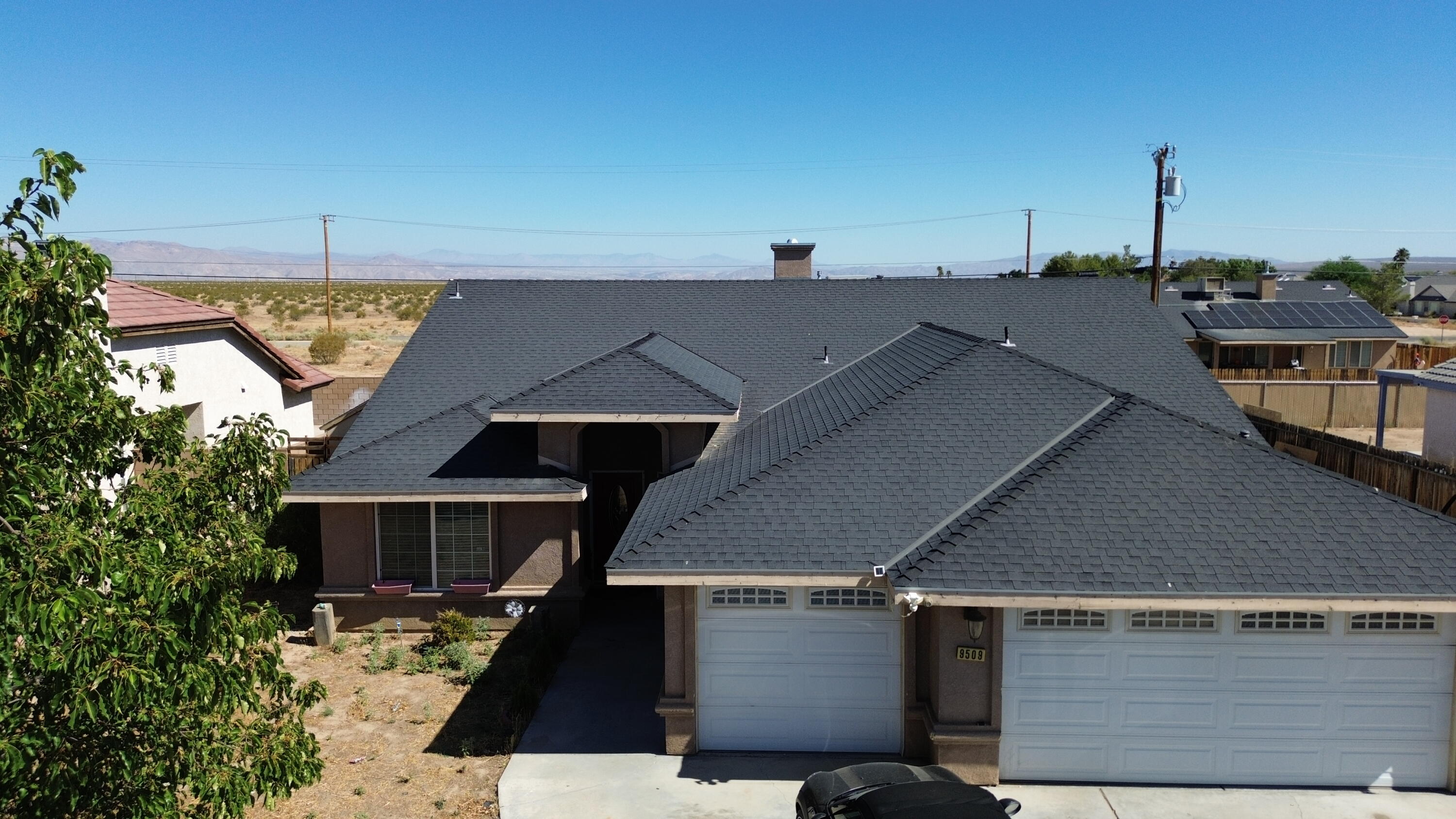 an aerial view of a house with parking space