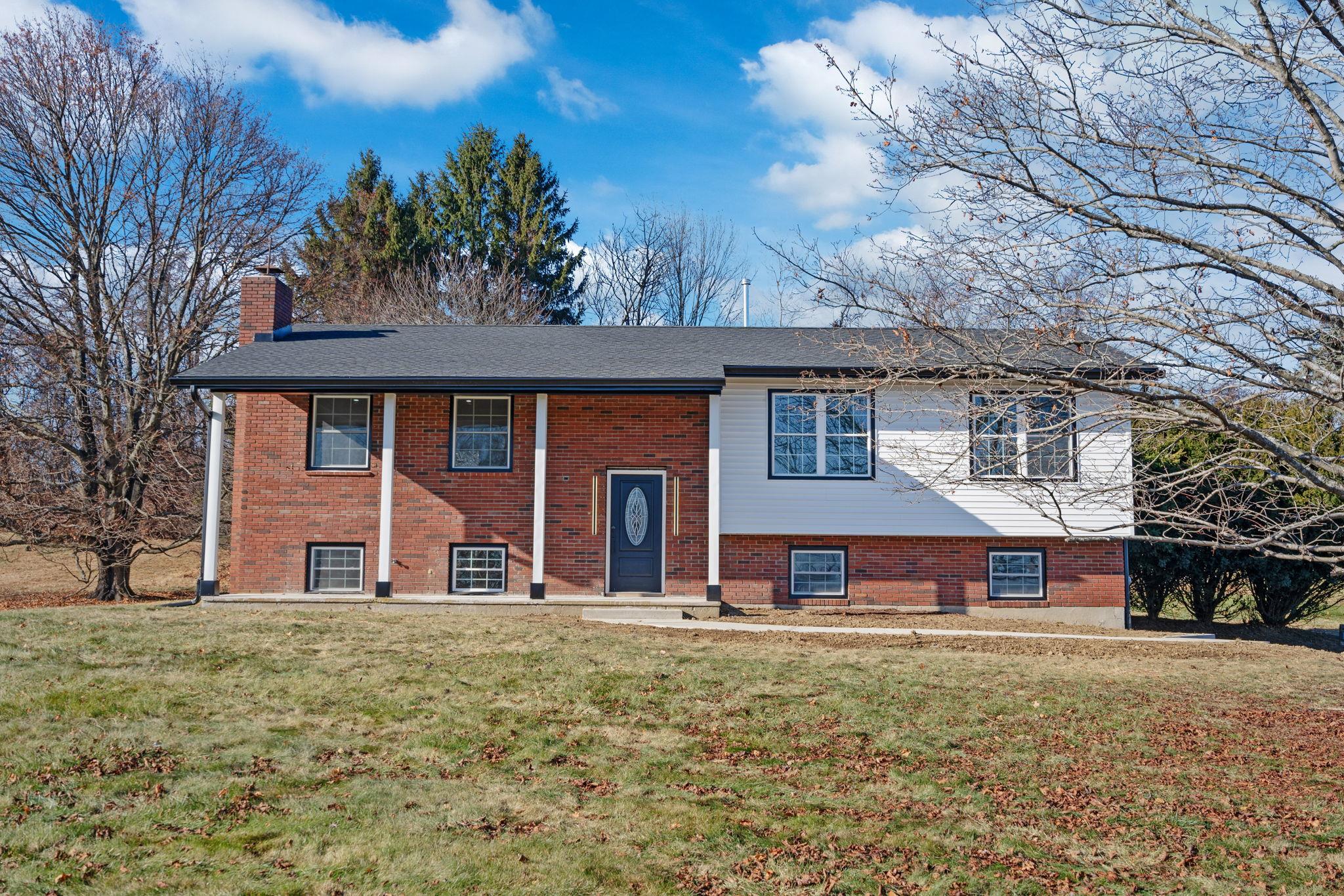 Split foyer home with a front lawn