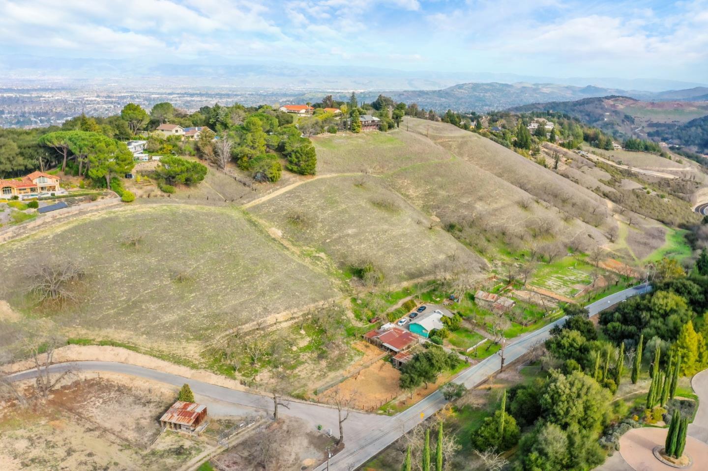 an aerial view of a houses with a yard