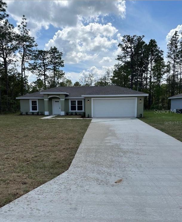 front view of a house next to a yard