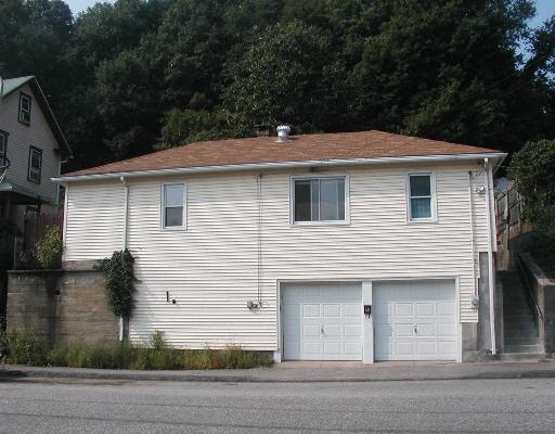 a front view of a house with garage