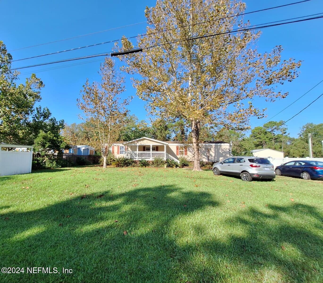 a view of a house with a back yard