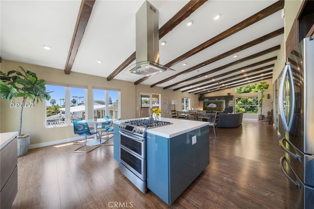 a kitchen with stainless steel appliances granite countertop a stove and a refrigerator