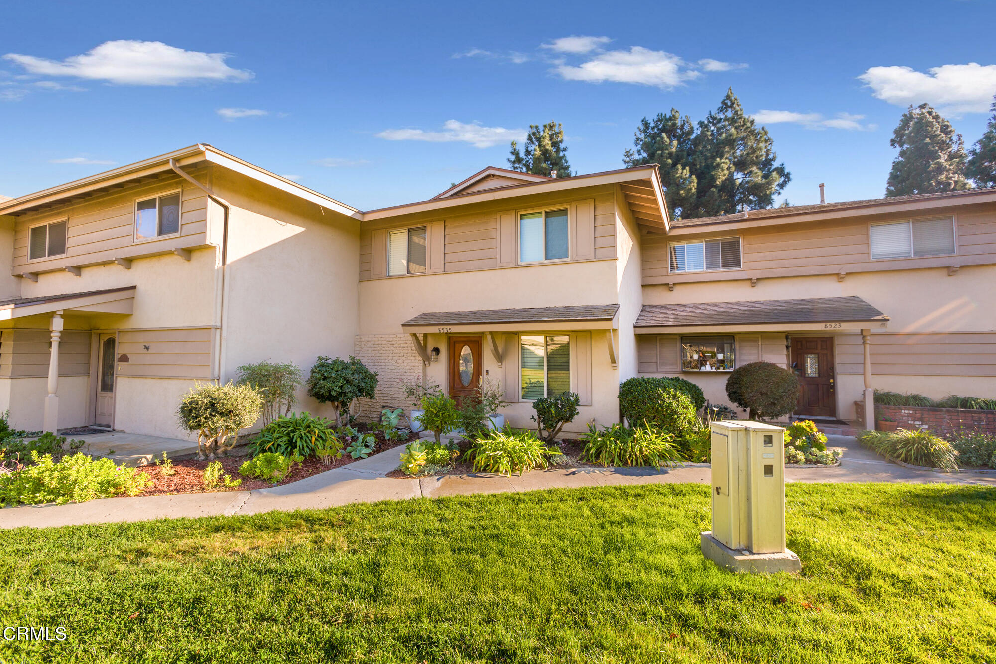 a front view of a house with swimming pool yard and outdoor seating