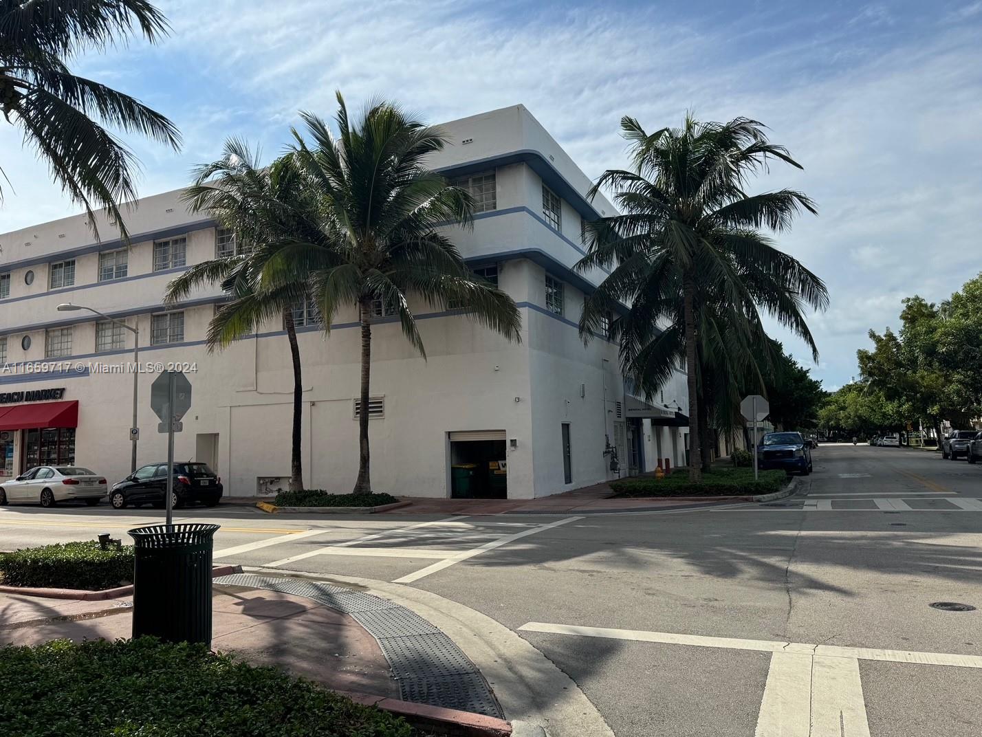 a couple of palm trees in front of building