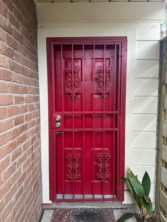 a view of a door with a red gate