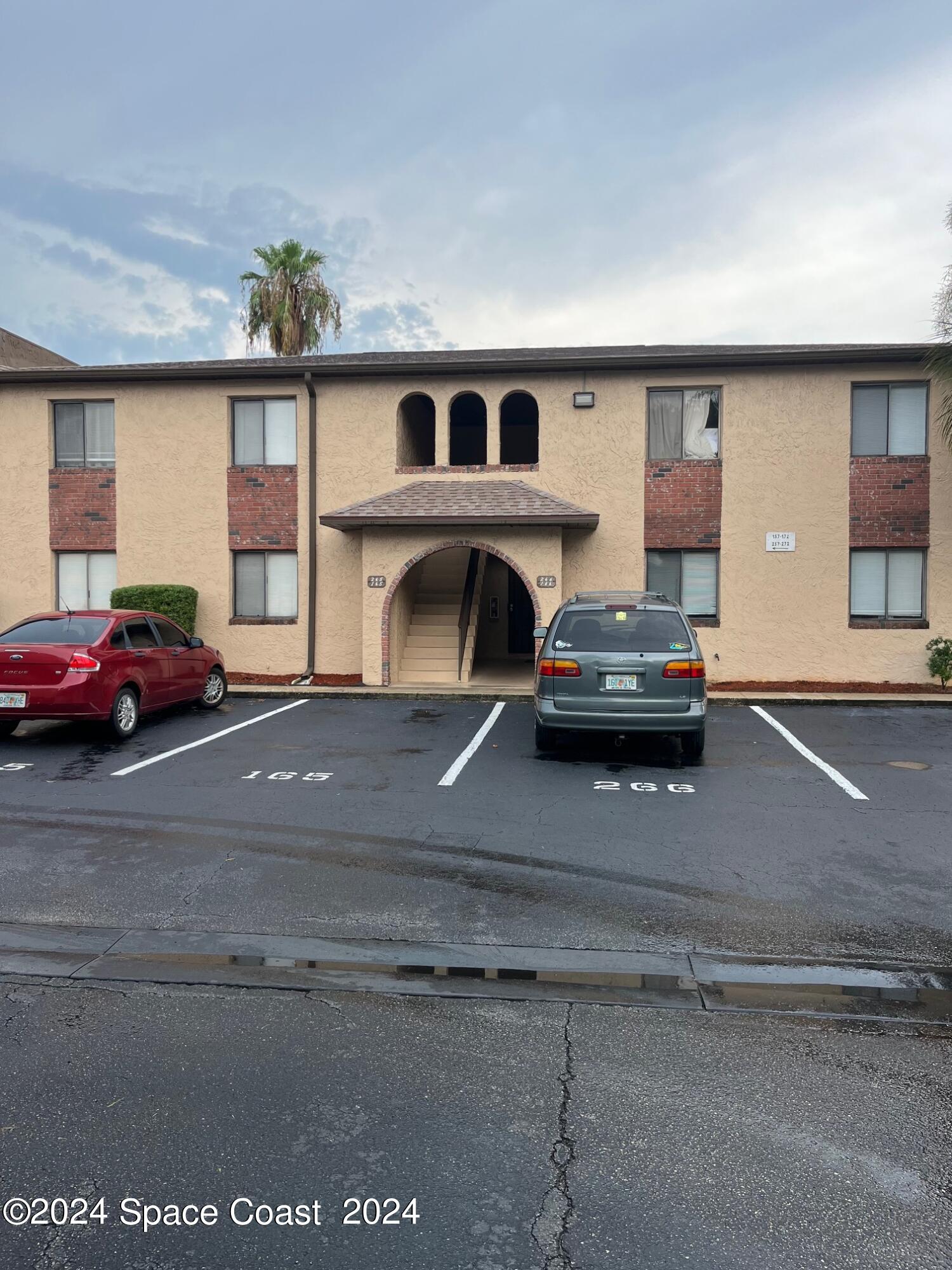 a view of a car parked in front of a building