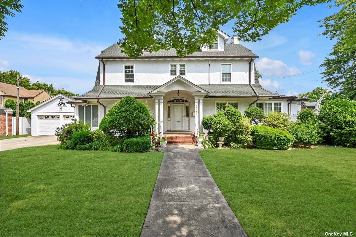 a front view of a house with yard