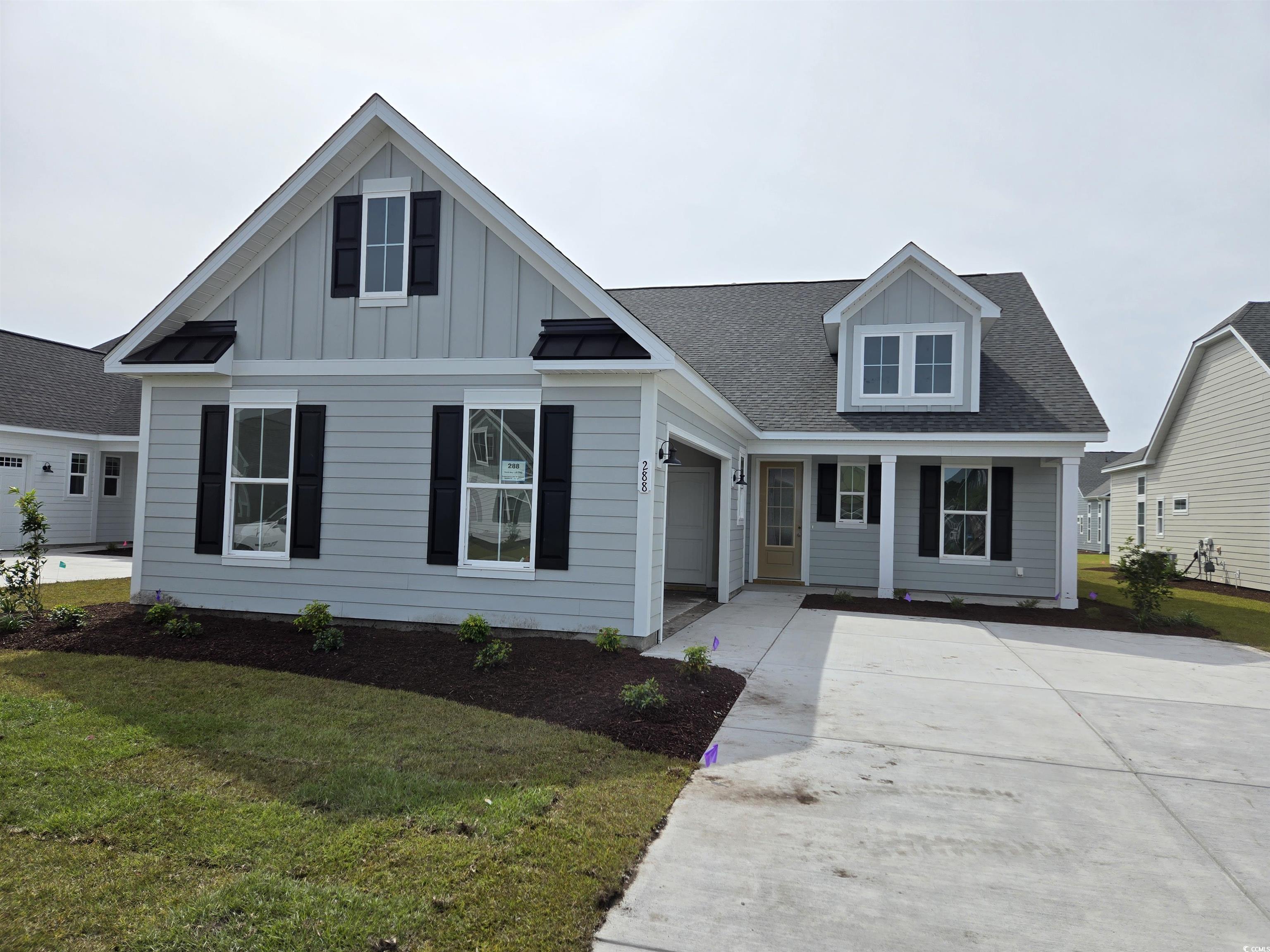 View of front facade with a garage and a front yar