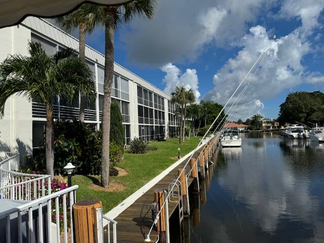 a view of a house with pool and deck