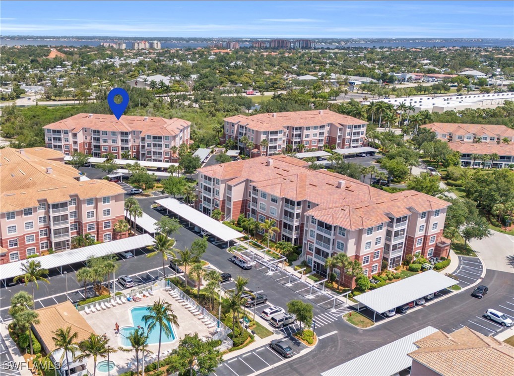 an aerial view of a houses with a city street