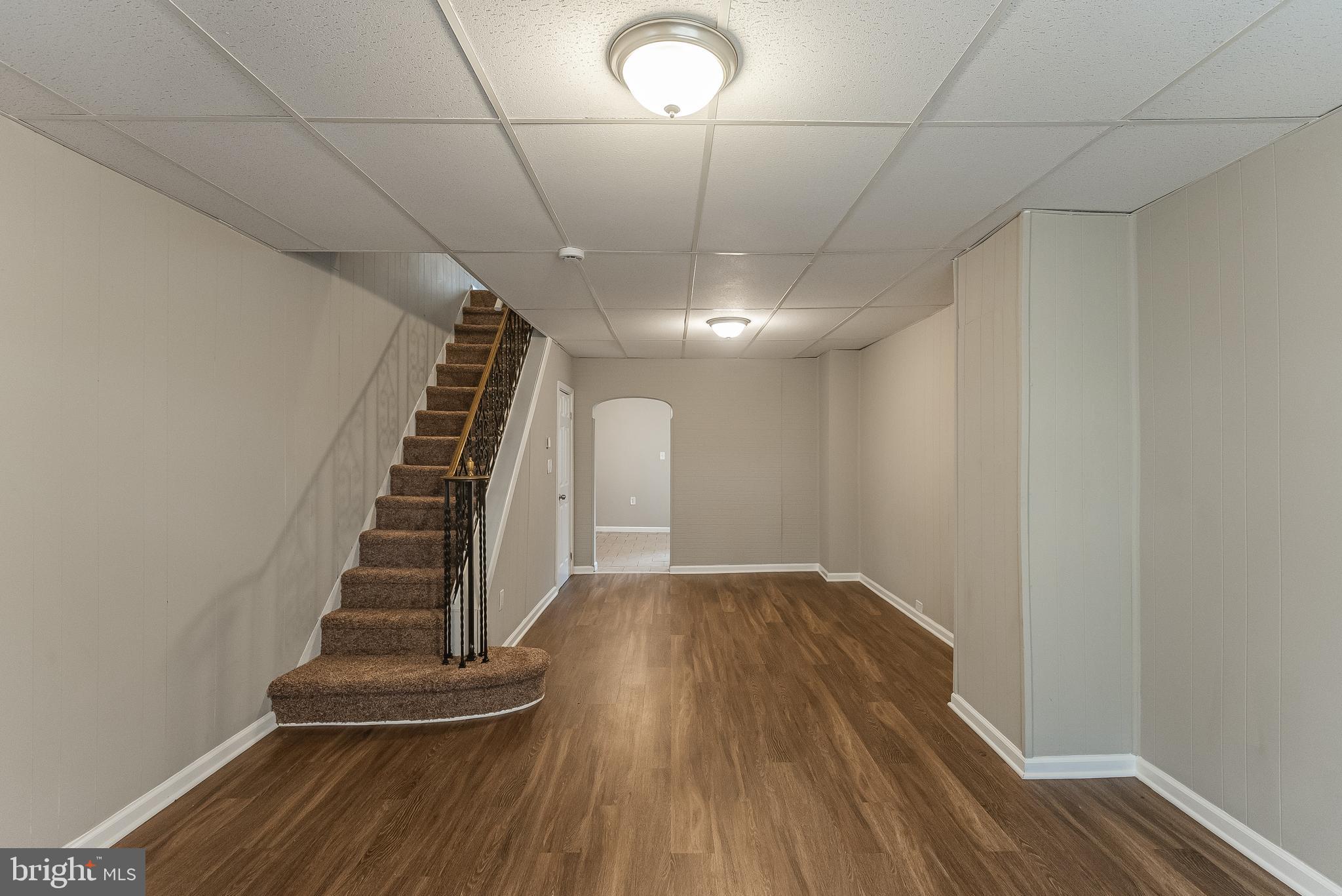 a view of entryway with stairs and wooden floor