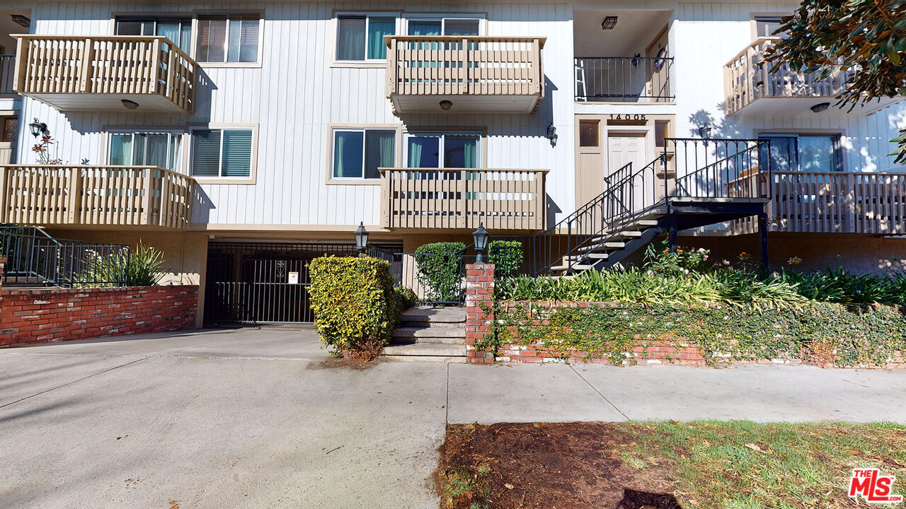 a front view of a building with garden