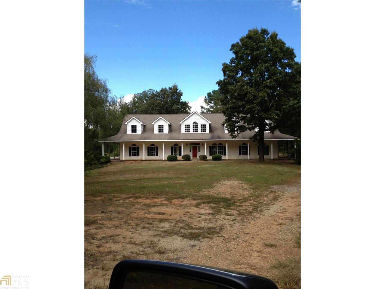 a view of a house with a swimming pool