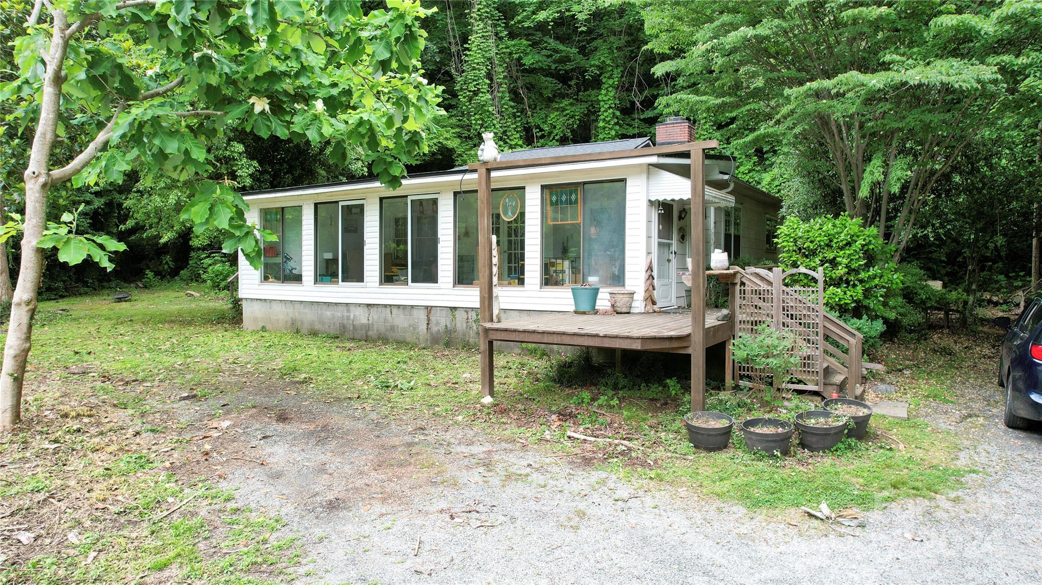 a view of a house with a yard and sitting area