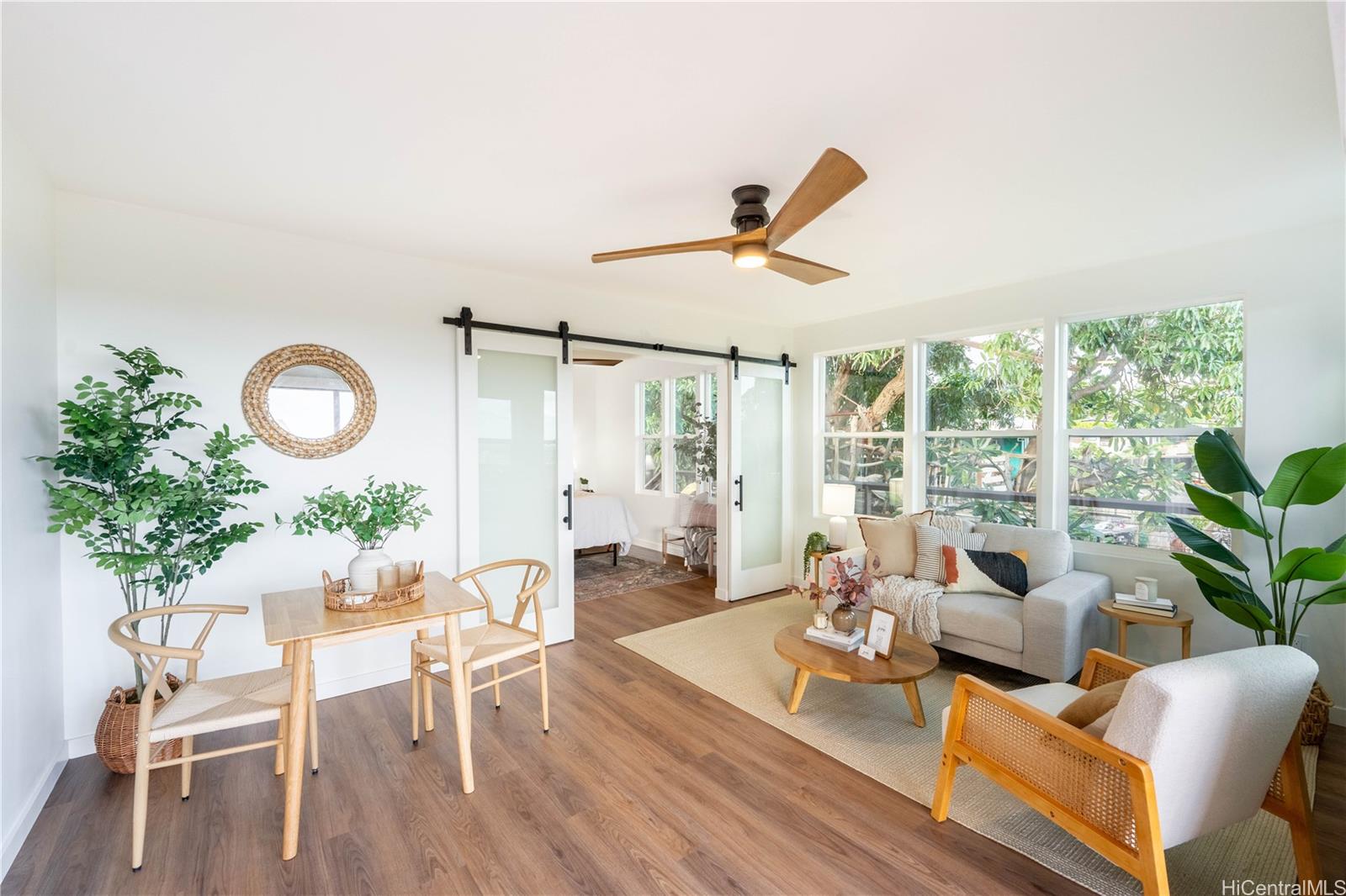 a living room with furniture and a large window