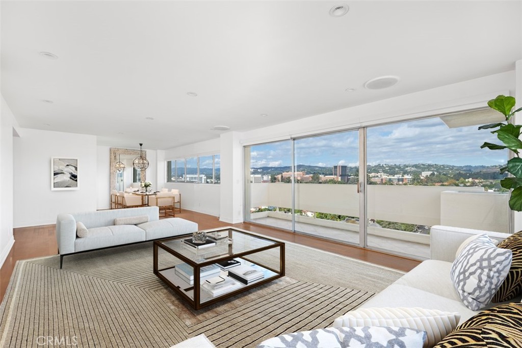 a living room with furniture and a table