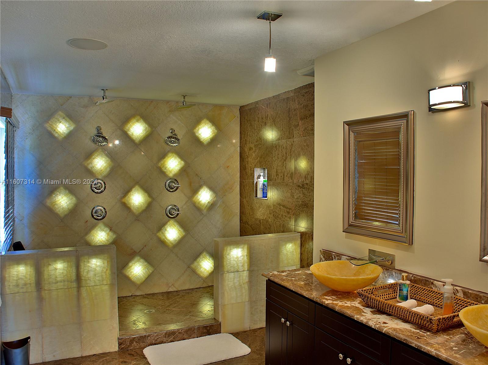 a bathroom with a sink vanity and mirror