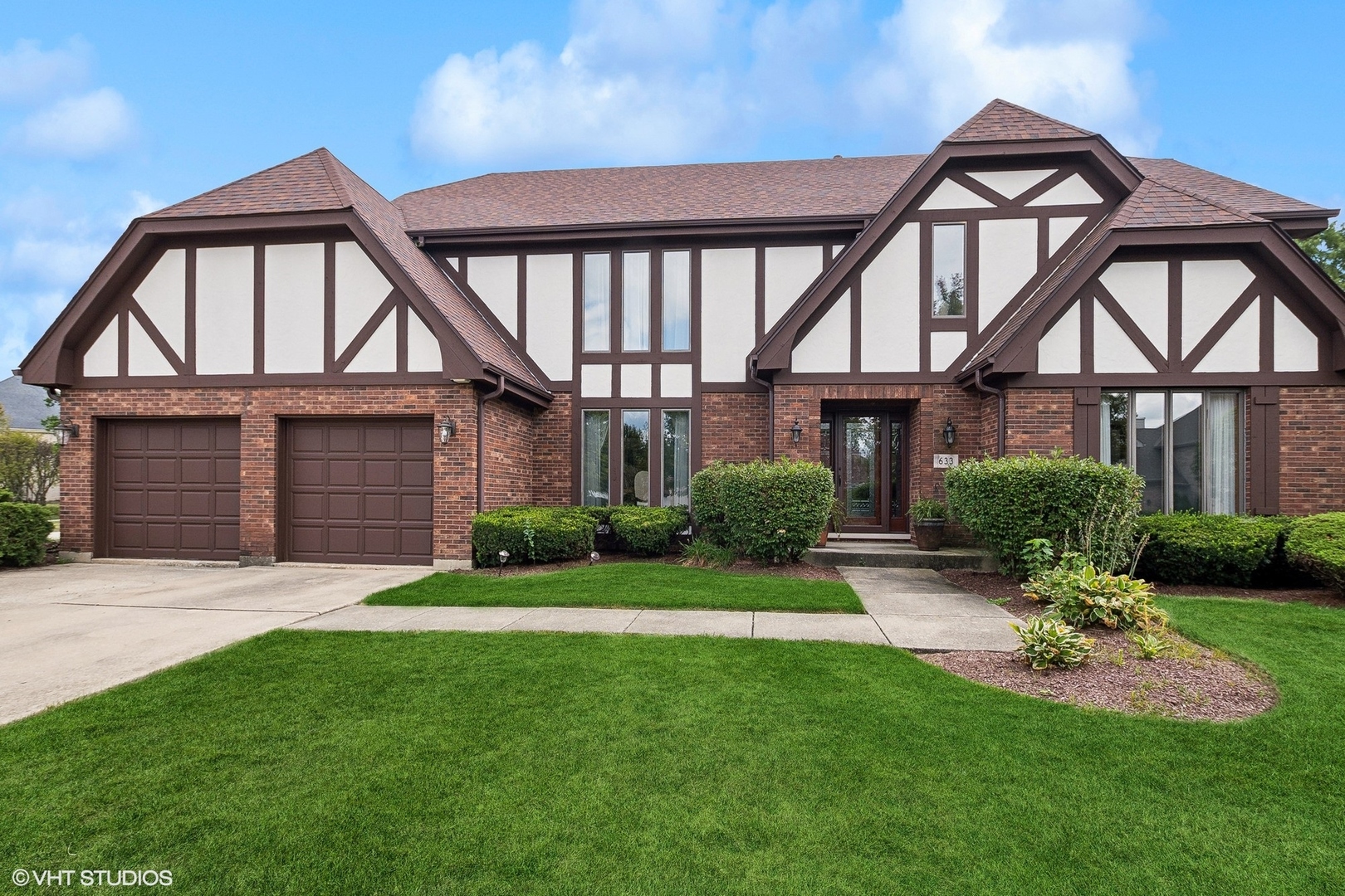 front view of a house with a yard