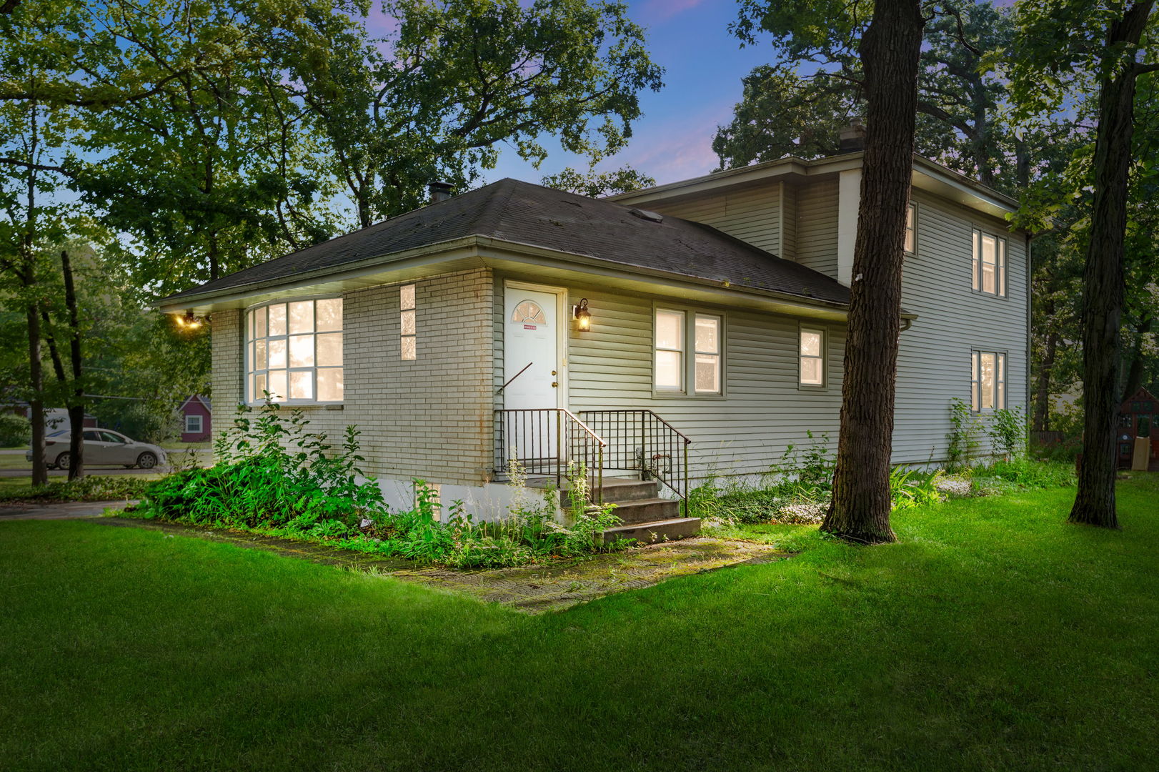 a front view of a house with a yard