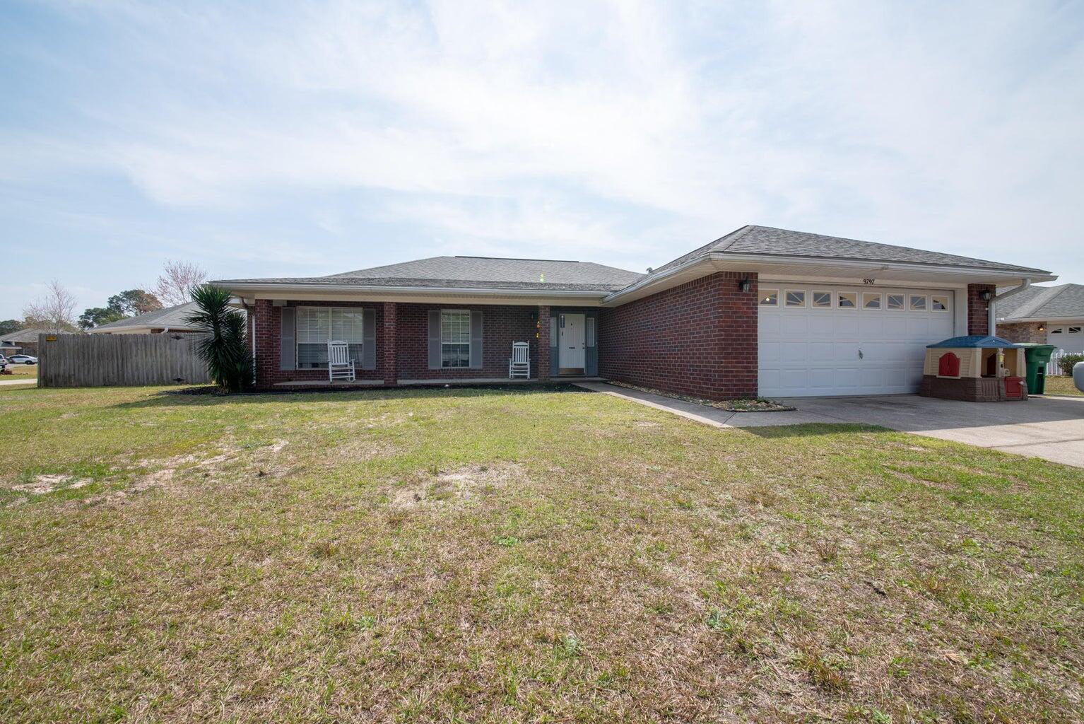 a view of house with yard