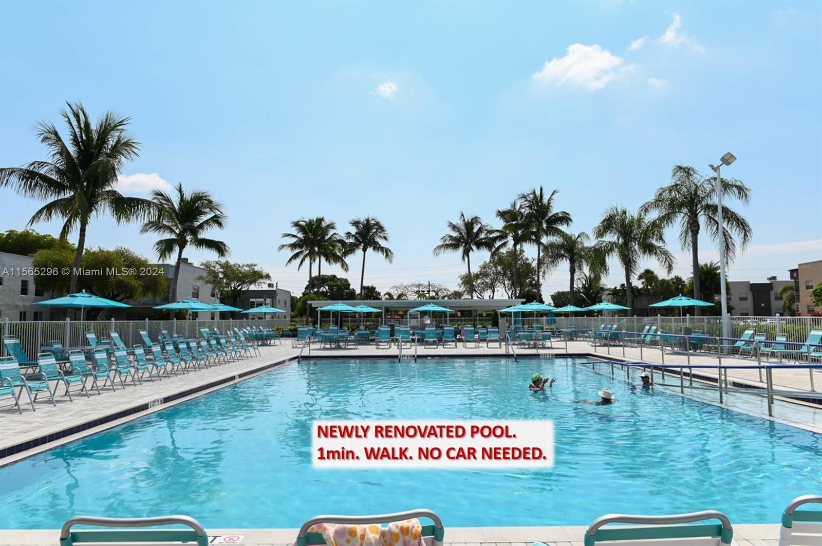 a view of swimming pool with a table and chairs