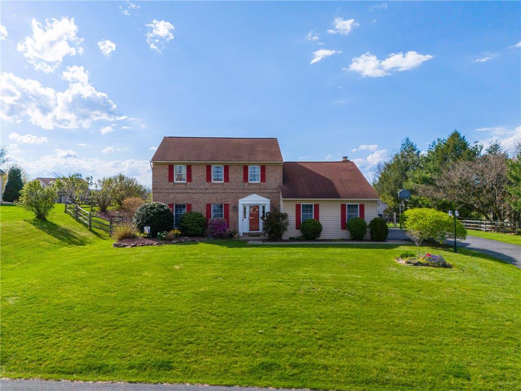 a view of a house with a big yard