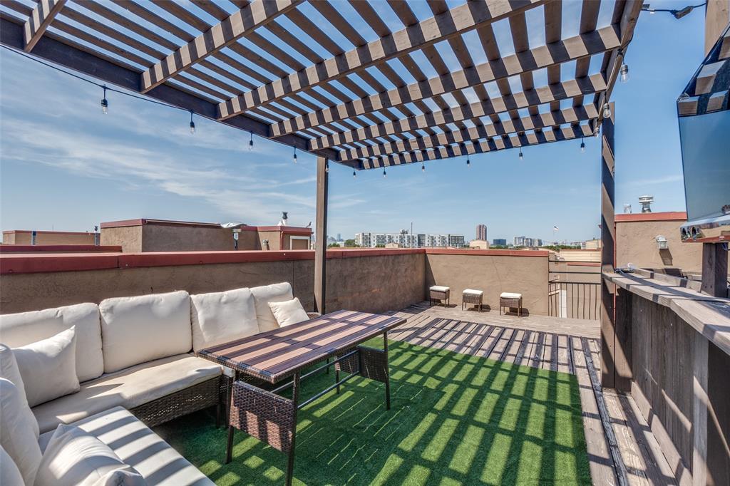 a terrace of a house with outdoor seating