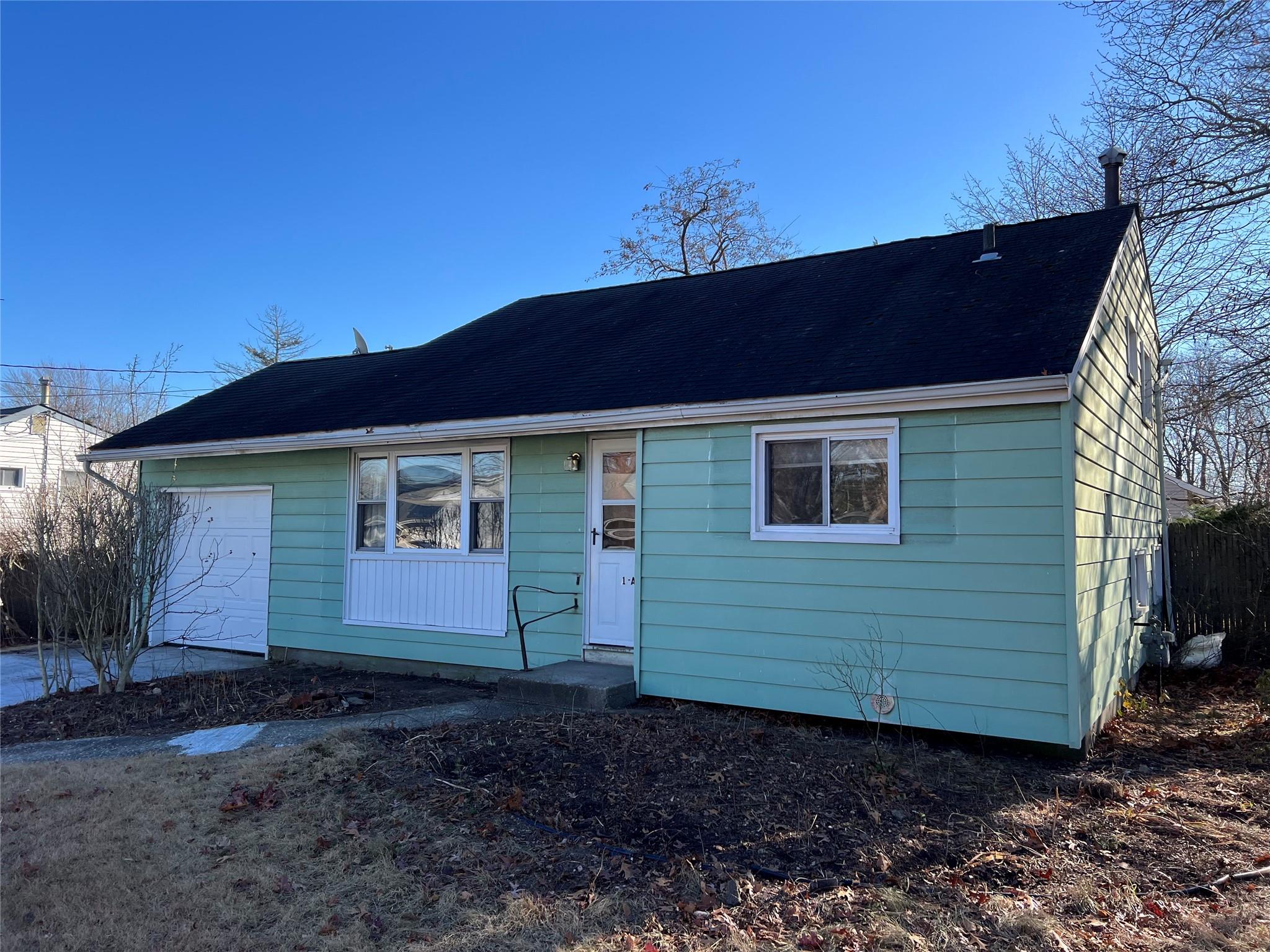 View of front of home with a garage